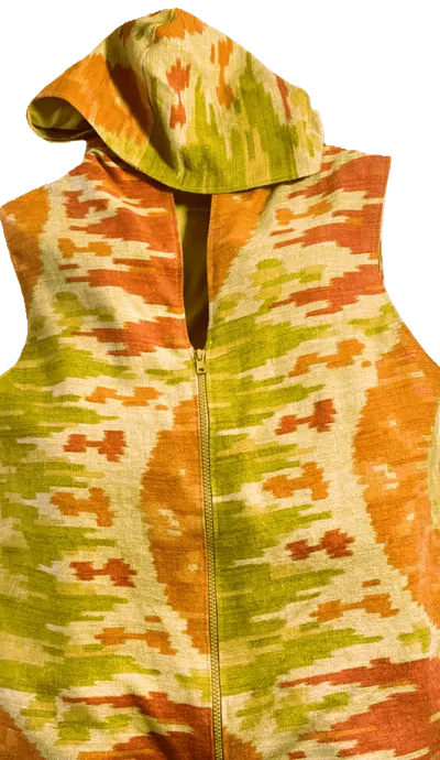 Handcrafted orange, ochre and green patterned travel vest